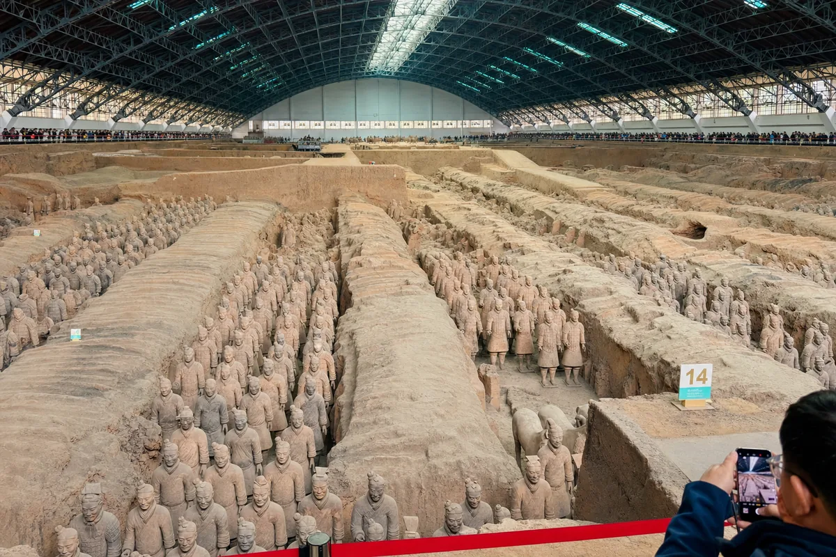 Rows of life-size Terracotta Army soldiers standing in Pit 1 in Xi'an