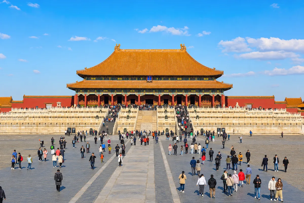 Visitors walking through the central courtyards of the Forbidden City in Beijing