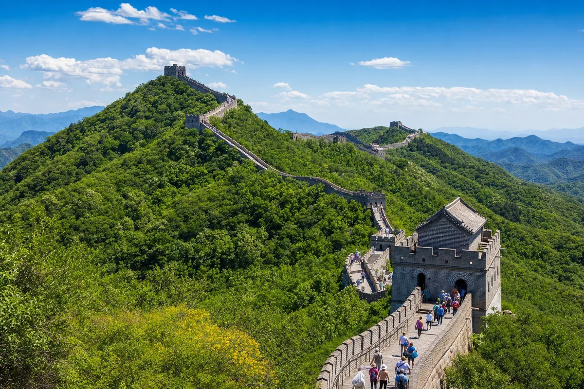 The restored Great Wall at Mutianyu winding over forested ridges near Beijing