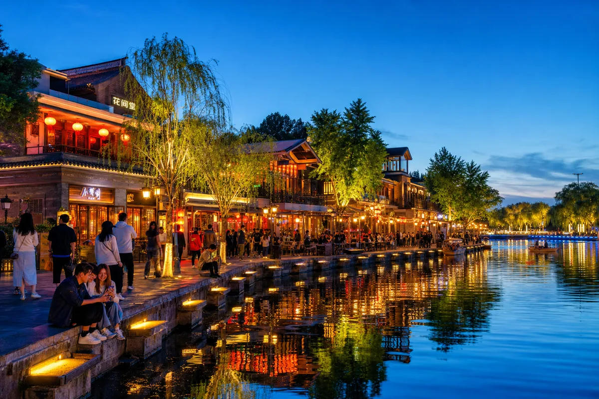 Evening lakeside scene at Houhai with hutong lanes and lights in Beijing