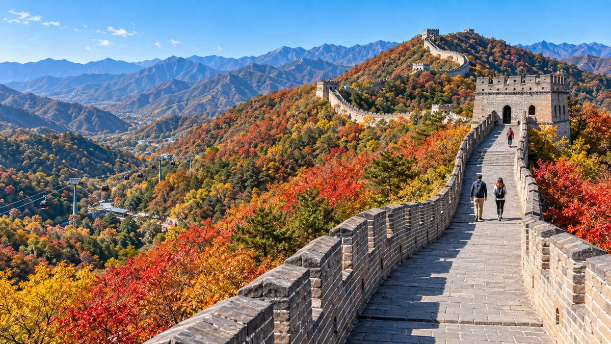 Hikers walking between watchtowers on the restored Mutianyu section of the Great Wall in autumn