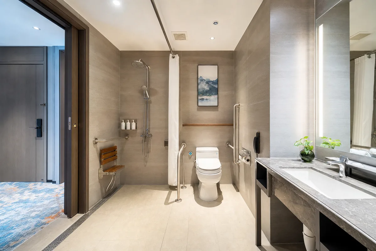Accessible hotel bathroom in China with roll-in shower and grab bars