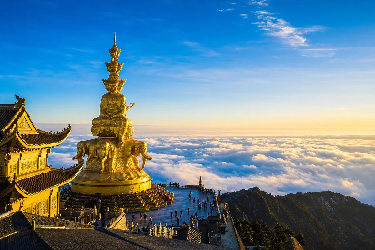 The Golden Summit of Mount Emei with a golden Buddhist statue above a sea of clouds
