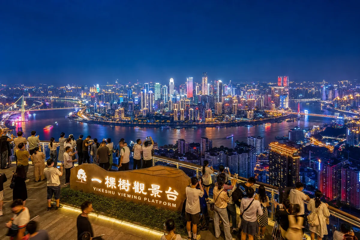 Panoramic night view of Chongqing's lit skyline and two rivers from Nanshan mountain