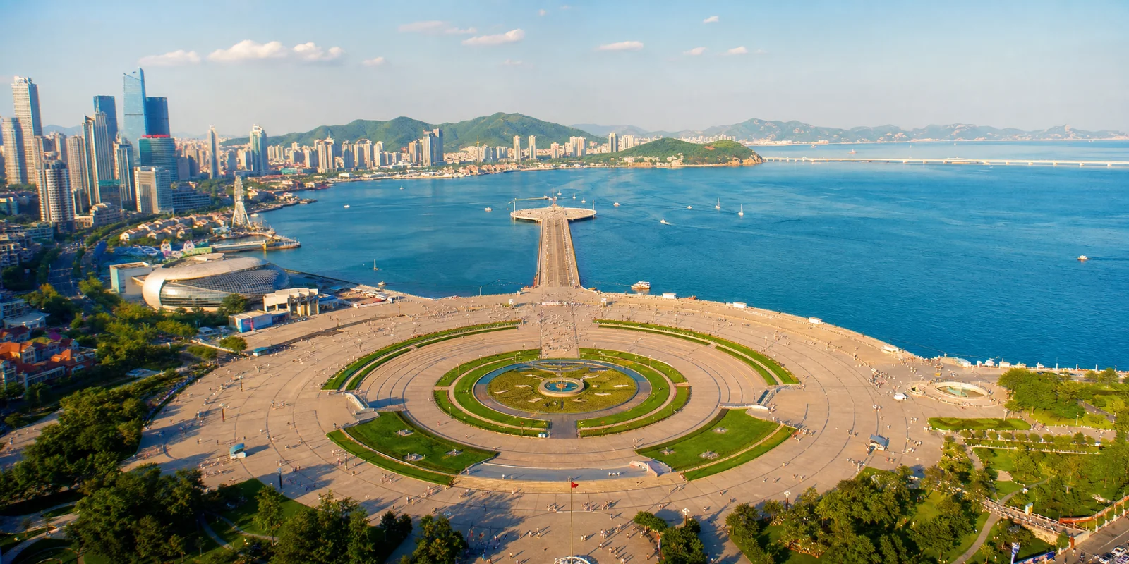 Aerial view of Xinghai Square and the bay in Dalian on a clear summer day