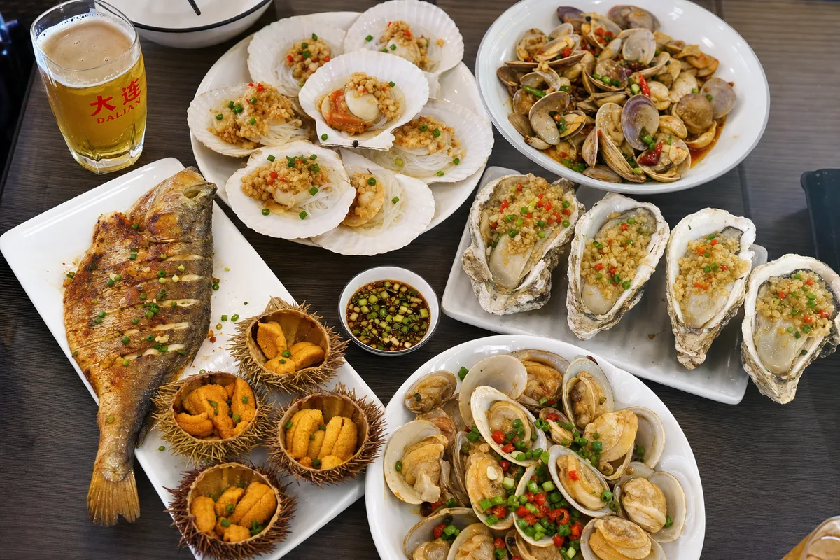 Fresh Dalian seafood spread with shellfish, sea urchin and scallops