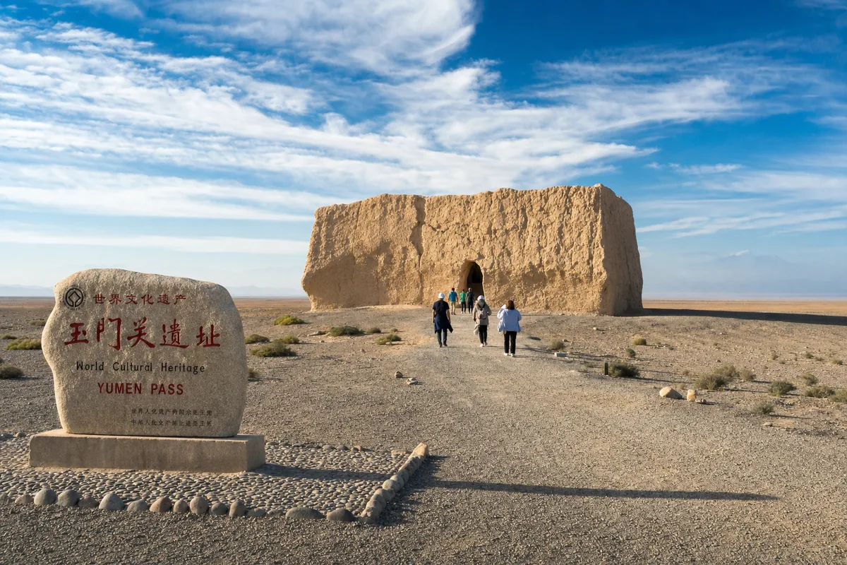 The rammed-earth ruins of Yumen Pass standing alone in the Gobi desert west of Dunhuang