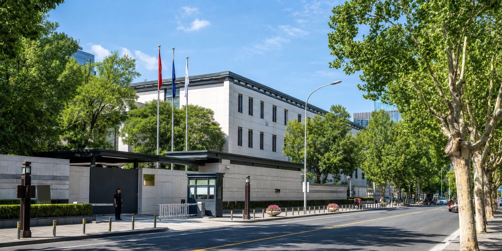 Embassy district street in Beijing with diplomatic buildings and flags