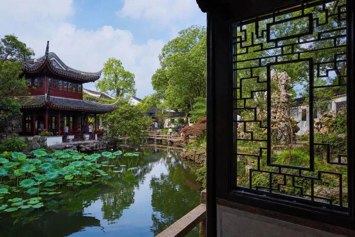A classical garden in Suzhou with pavilions, a pond, and framed views