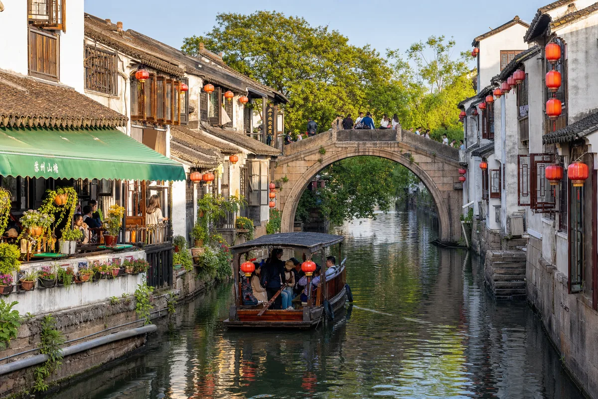 A water town near Suzhou with stone arch bridges over a canal and traditional houses