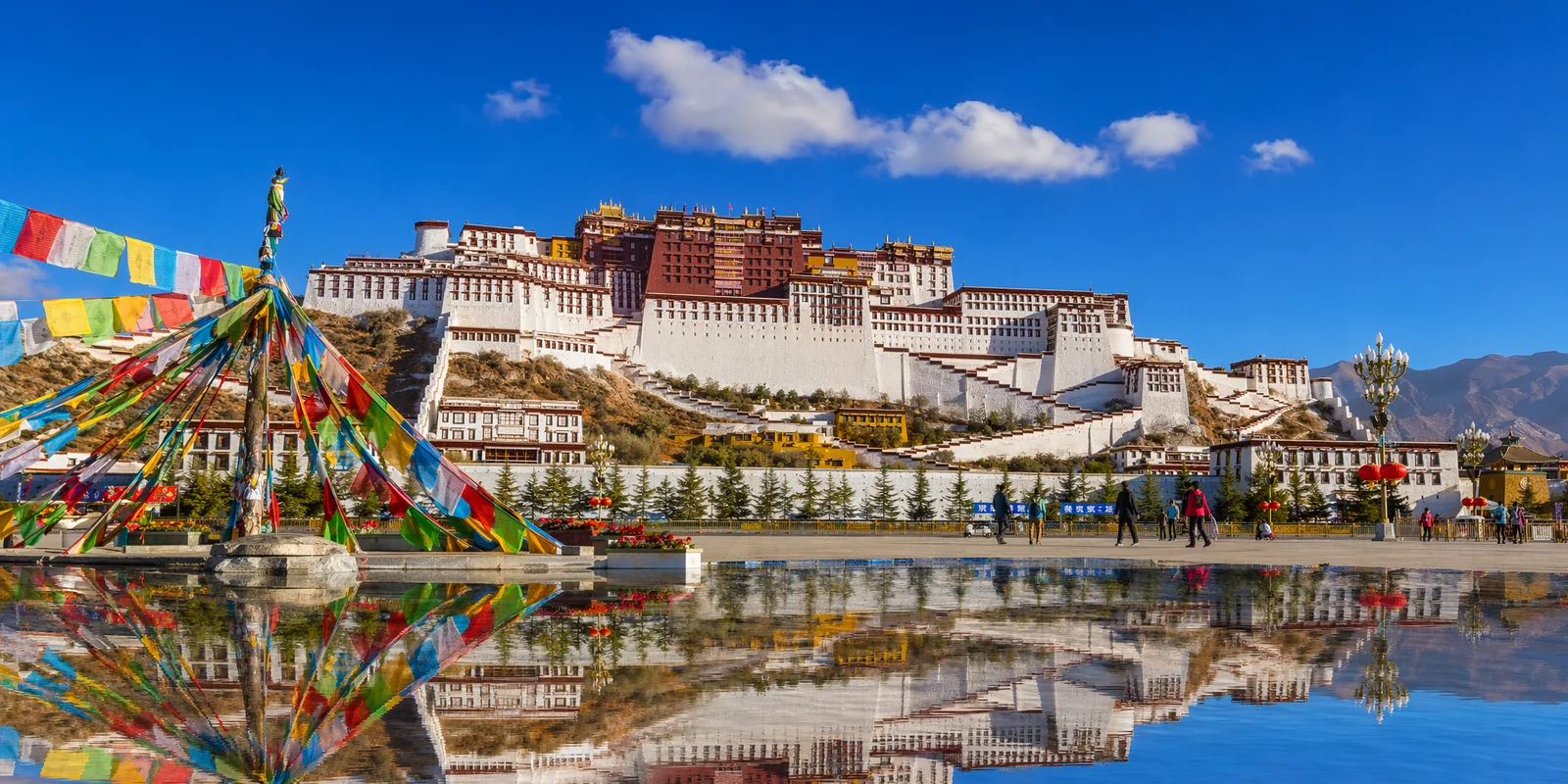 Potala Palace rising on the hillside in Lhasa under a clear blue Tibetan sky