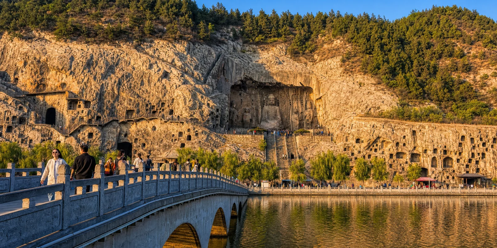 The giant Vairocana Buddha and cliff carvings at Longmen Grottoes along the Yi River in Luoyang