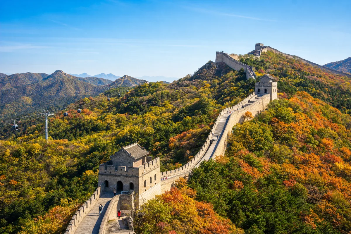 Mutianyu Great Wall winding along an autumn ridgeline with watchtowers and few visitors