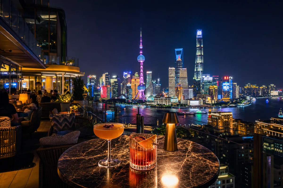 Rooftop bar terrace in Shanghai overlooking the Pudong skyline at night