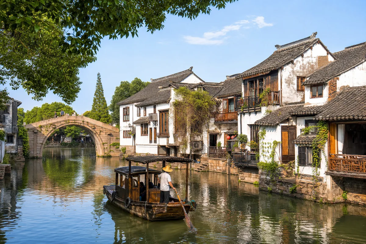 Stone bridge and traditional boat on a quiet canal in Zhujiajiao water town near Shanghai