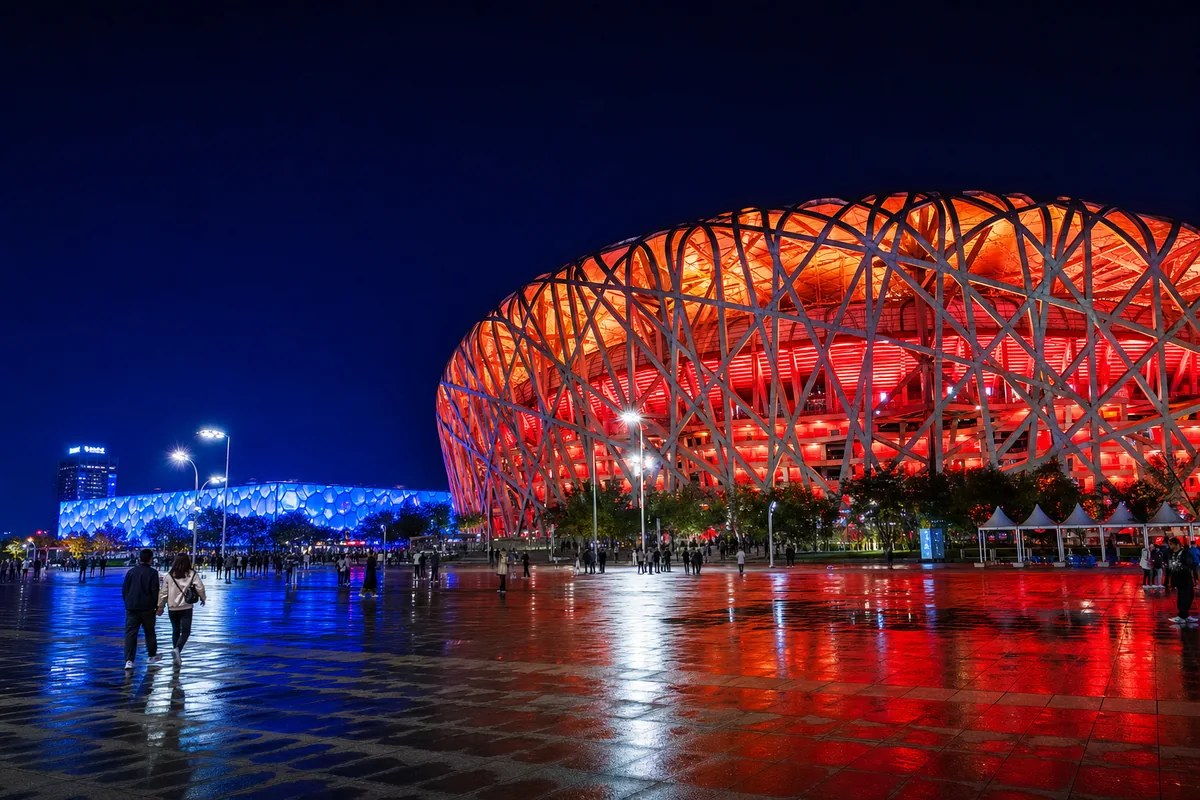 Beijing's Bird's Nest National Stadium and Water Cube lit up at night in the Olympic Park