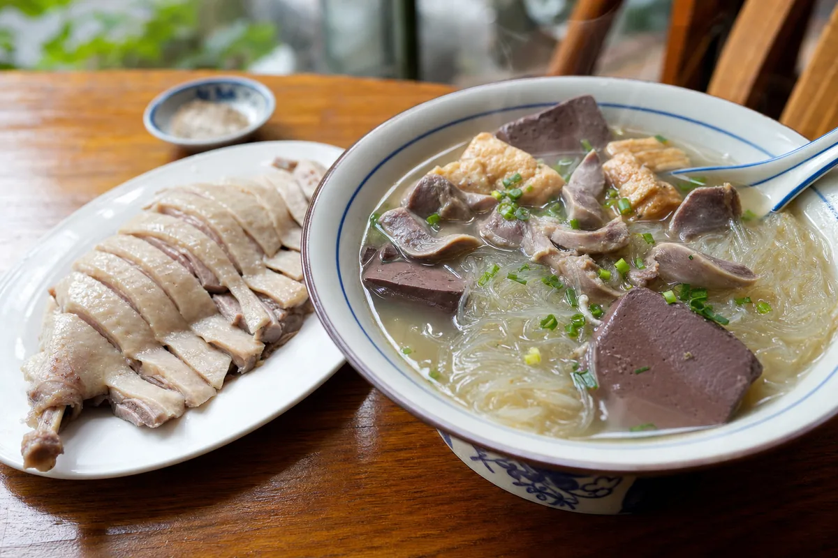 Sliced Nanjing salted duck and a bowl of duck blood vermicelli soup