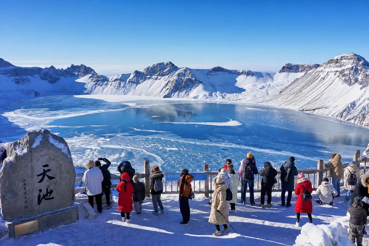 Frozen Tianchi crater lake at Changbaishan ringed by snow-covered peaks in winter