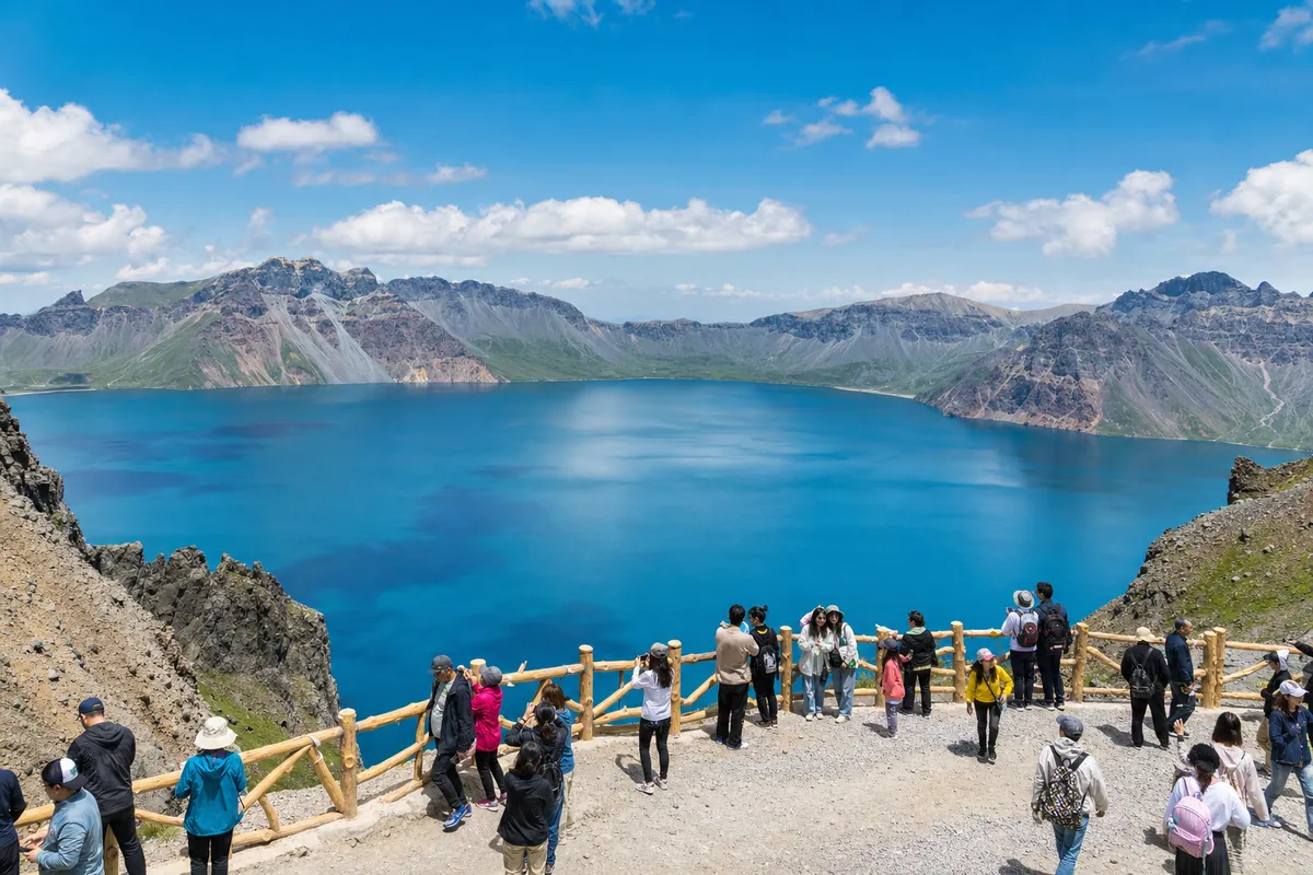 Changbaishan Tianchi lake in summer with blue water and green slopes