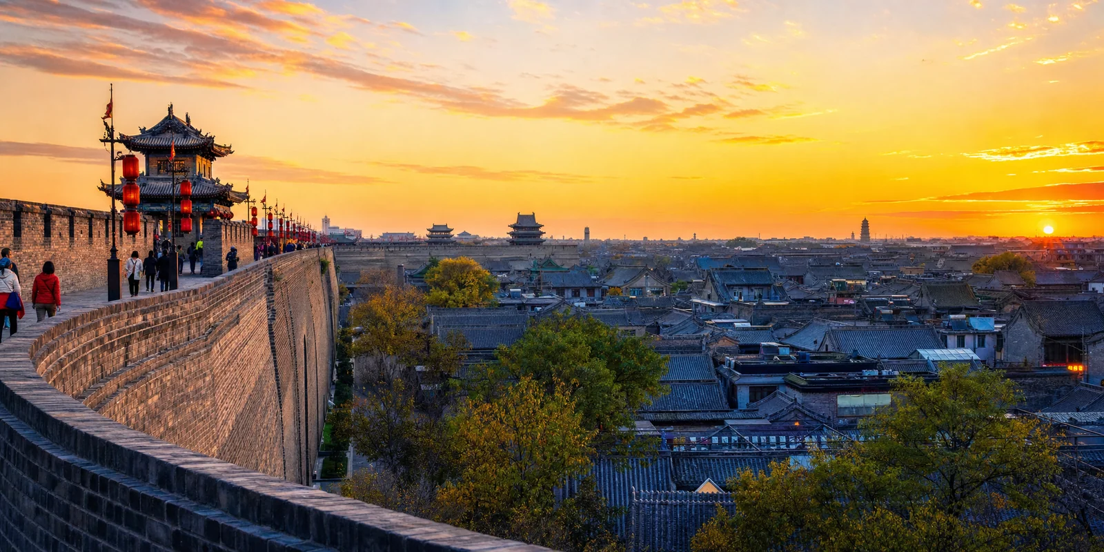 Pingyao ancient city wall at dusk overlooking grey-tiled rooftops of the old town
