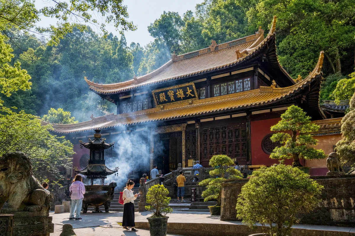Lingyin Temple main hall surrounded by forest near Hangzhou with ancient rock carvings