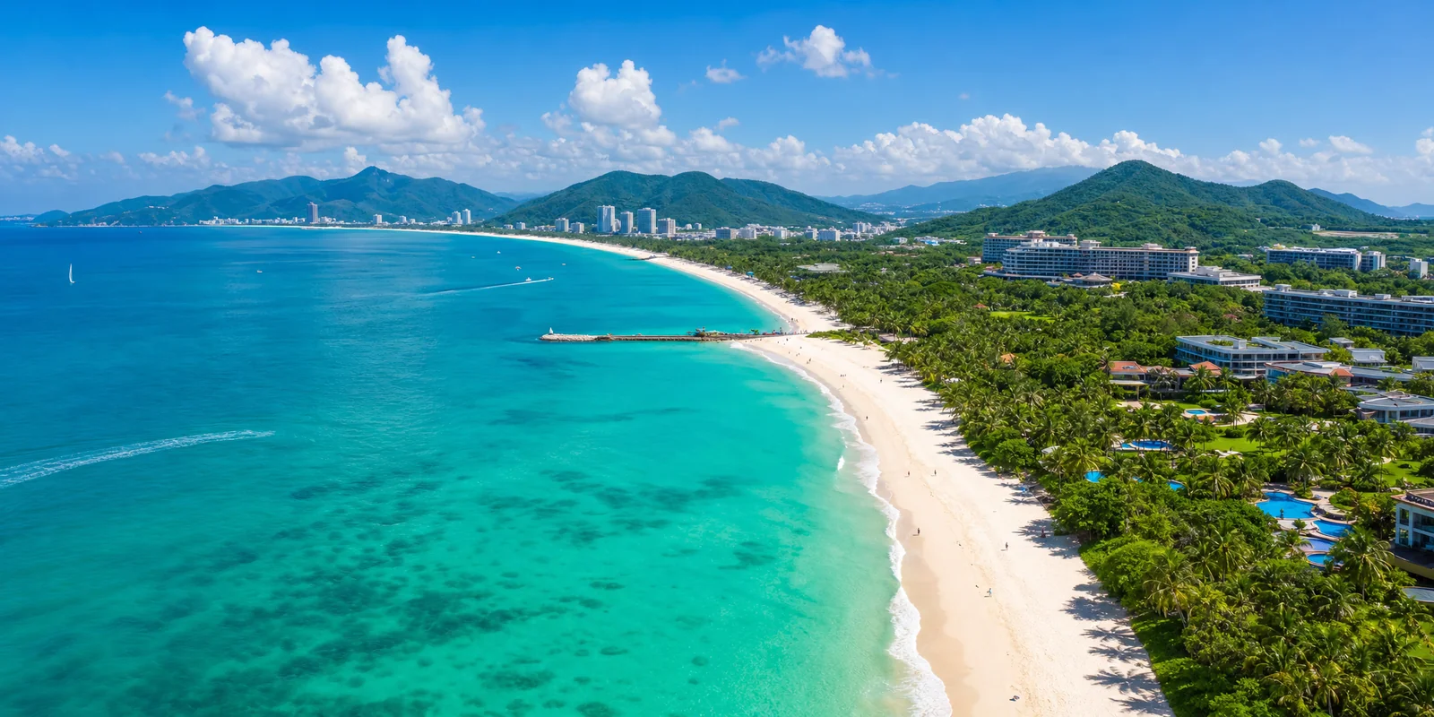 Aerial view of Yalong Bay in Sanya with white sand, turquoise water and resorts