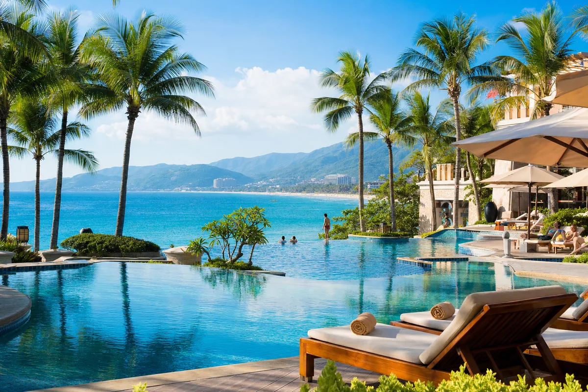 Beachfront resort pool and palm trees at Yalong Bay, Sanya