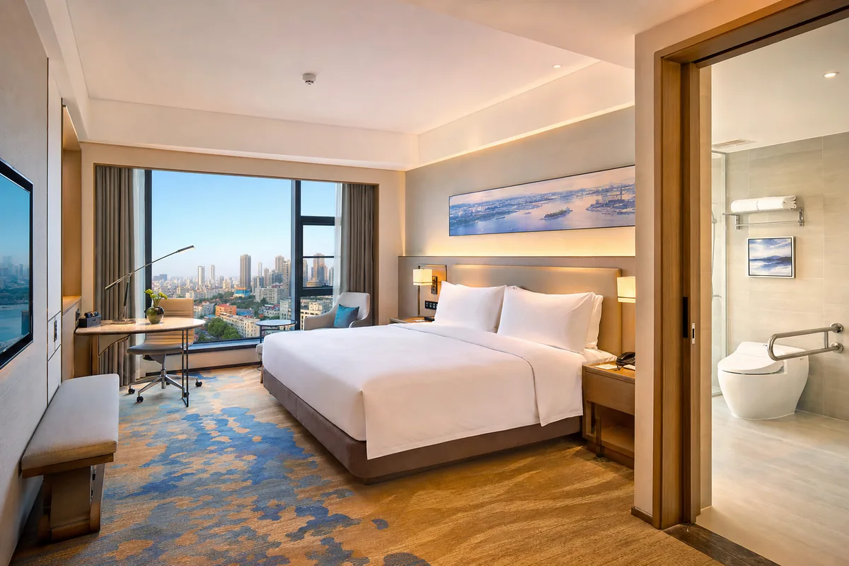 Comfortable and tidy mid-range hotel room with good natural light suitable for older guests