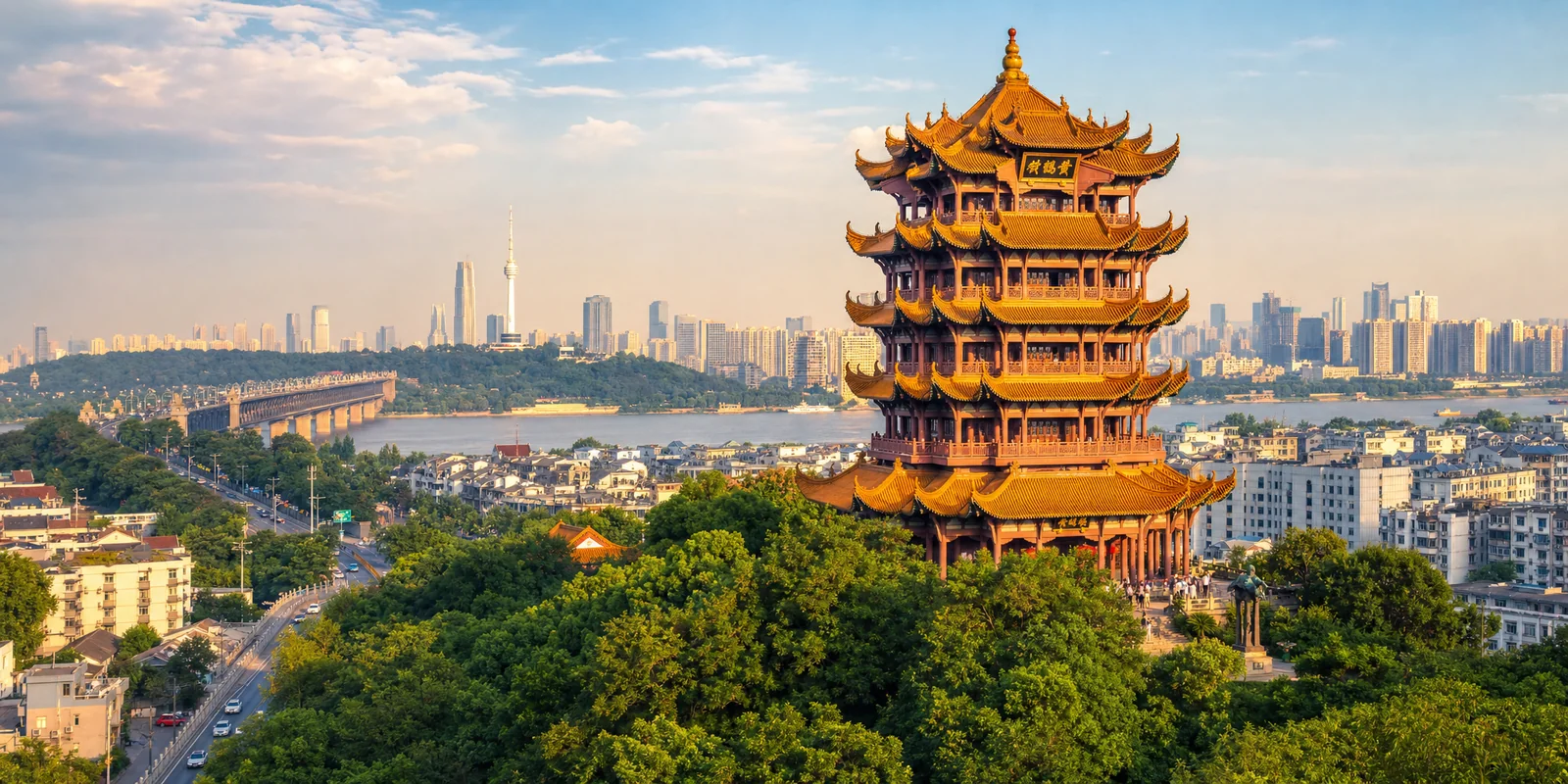 Yellow Crane Tower above the Yangtze River with the Wuhan skyline and river bridge