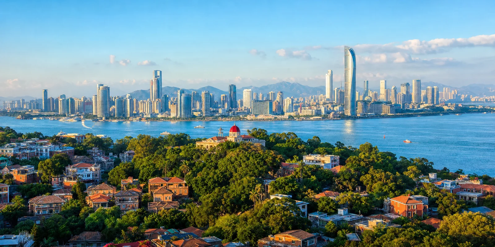 Xiamen coastline with Gulangyu Island historic villas and the city skyline across the water