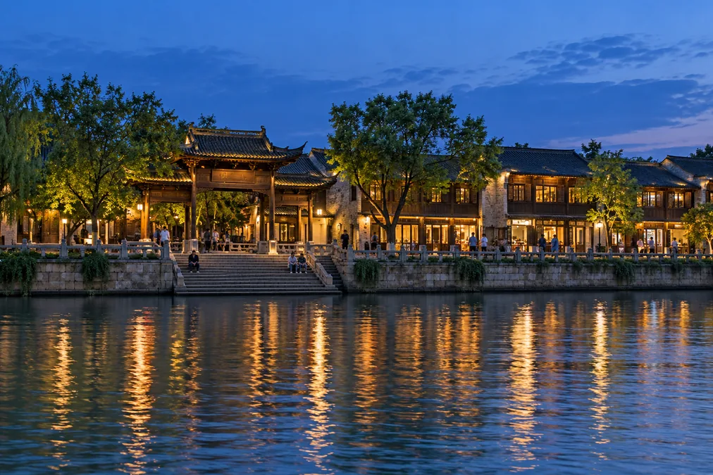 Stone steps and the gateway of the Dongguan Ancient Ferry on Yangzhou's old Grand Canal at dusk