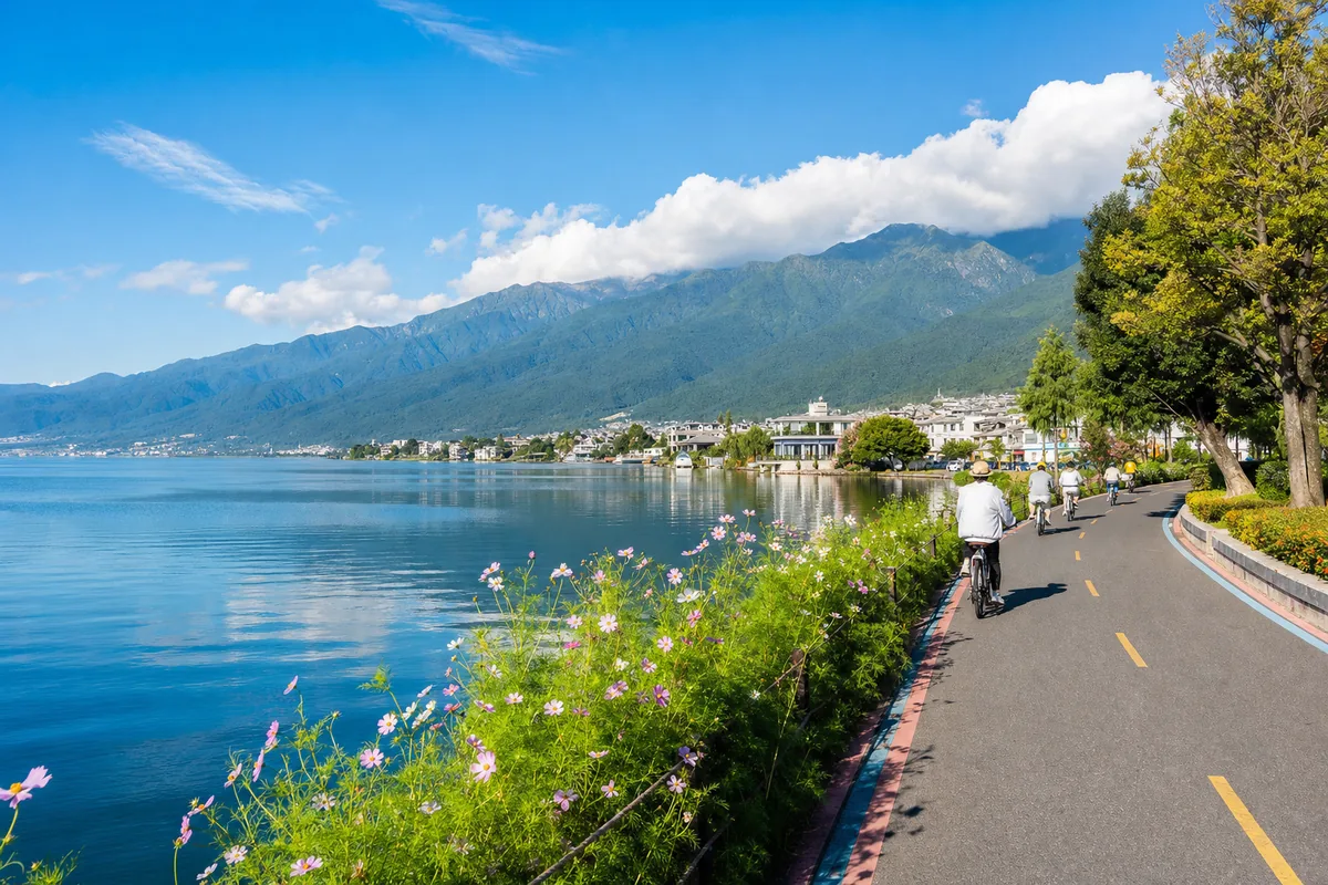 View of Erhai Lake from the eastern shore road in Dali with Cangshan mountains in the background