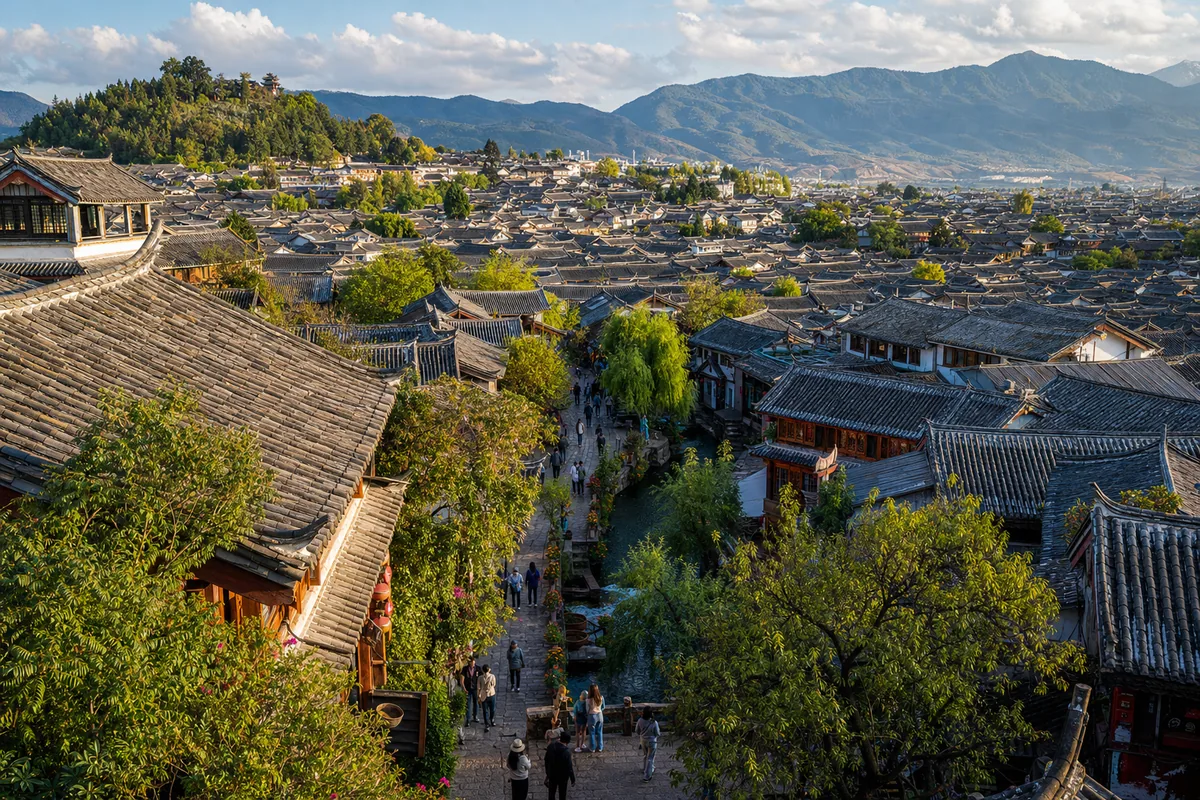 Aerial view over the grey-tiled rooftops and stone lanes of Lijiang Old Town