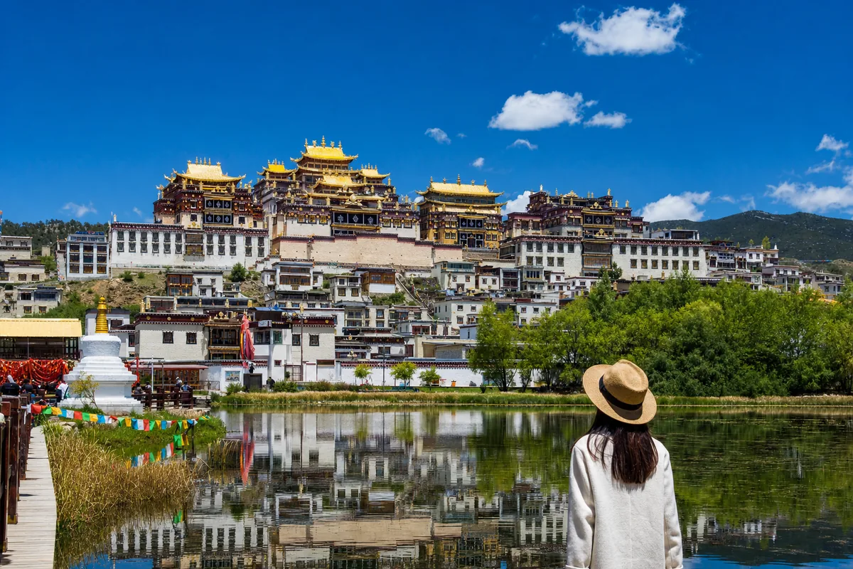 Songzanlin Monastery in Shangri-La, tiered golden-roofed Tibetan Buddhist halls on a hillside